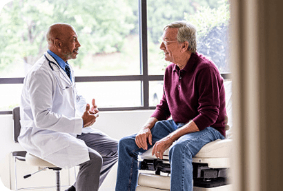 Doctor speaking with LR-MDS patient about REBLOZYL